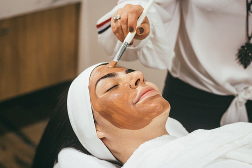 Face cleansing brush in use skincare routine